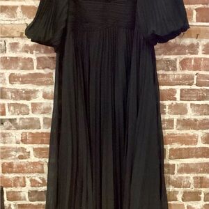 Terri Jon Chiffon Puff Gown Black sold at
terrijon site and Saks Fifth Avenue